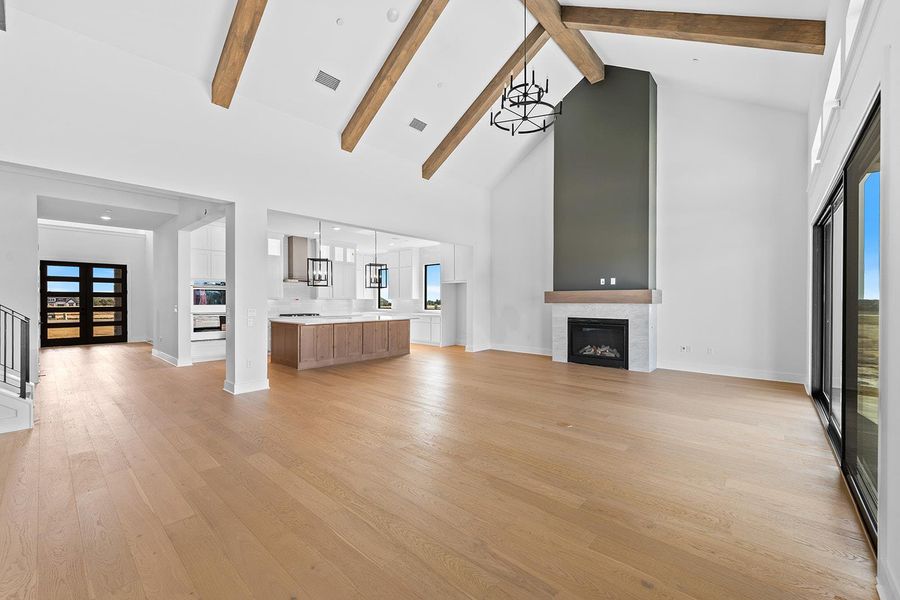 Unfurnished living room featuring a fireplace and light wood-style floors