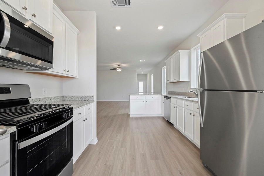 Furnished interior view inside a new home in Vacek Country Meadows, Richmond (Image 5). Furnished interior view inside a new home in Vacek Country Meadows, Richmond (Image 5).