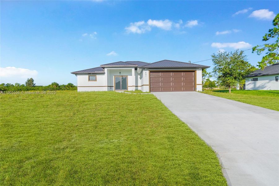 Front exterior of a new home in , Lehigh Acres, FL, highlighting curb appeal (Image 19).