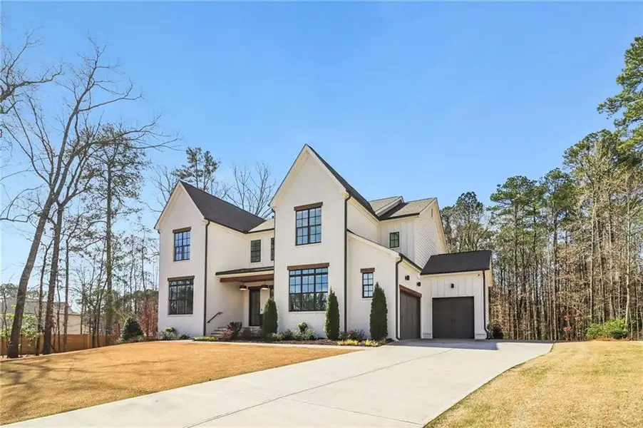 Front exterior of a new home in , Roswell, GA, highlighting curb appeal (Image 1). Front exterior of a new home in , Roswell, GA, highlighting curb appeal (Image 1).