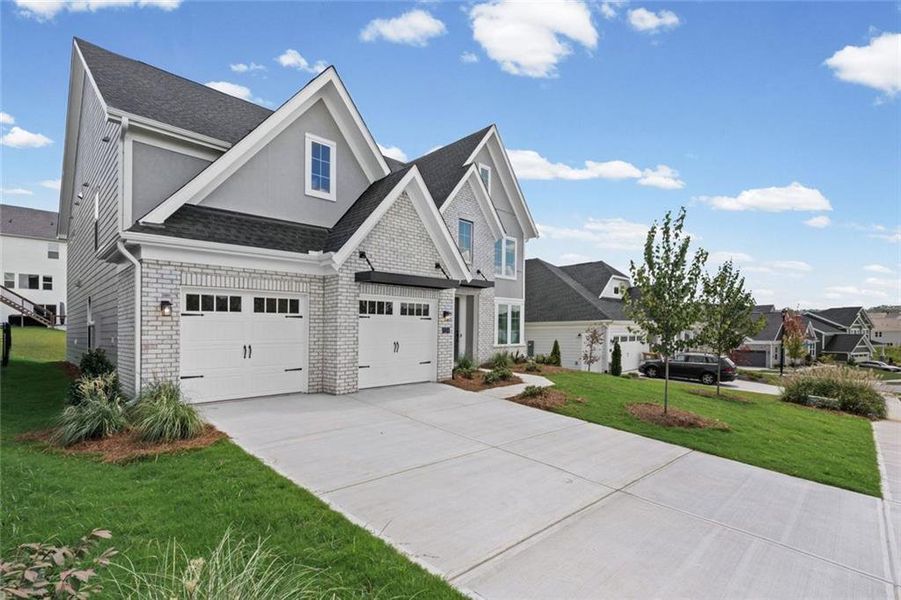 Front exterior of a new home in Twin Lakes, Hoschton, GA, highlighting curb appeal (Image 24).