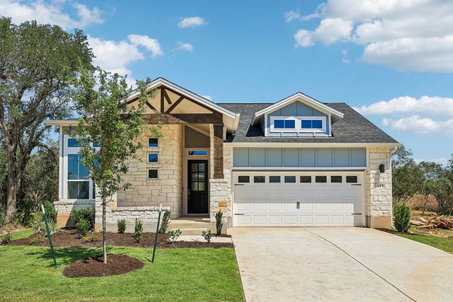 Front exterior of a new home in Persimmon, Buda, TX, highlighting curb appeal (Image 1). Front exterior of a new home in Persimmon, Buda, TX, highlighting curb appeal (Image 1).