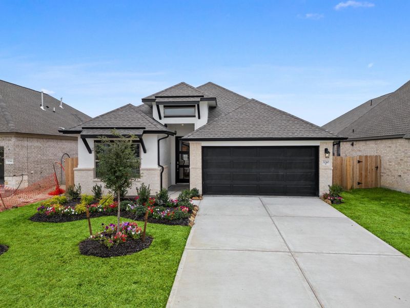 Front exterior of a new home in , Spring, TX, highlighting curb appeal (Image 24).