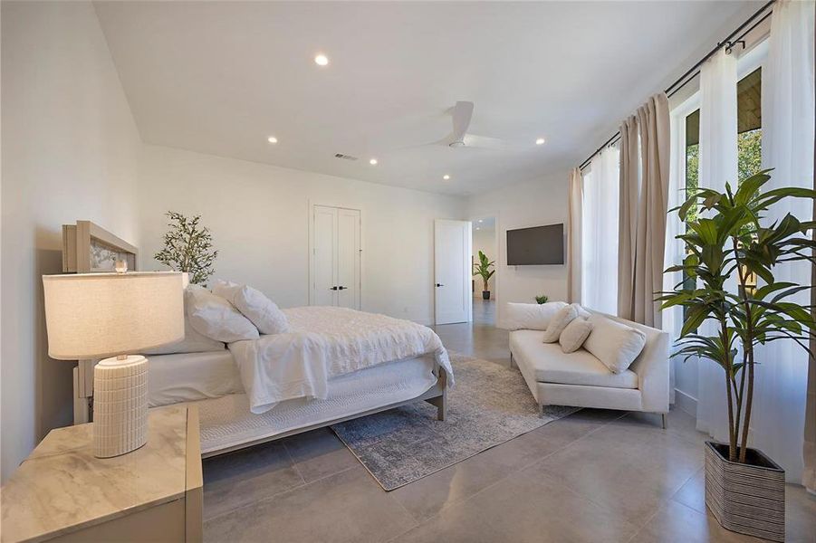 Bedroom featuring ceiling fan and a closet