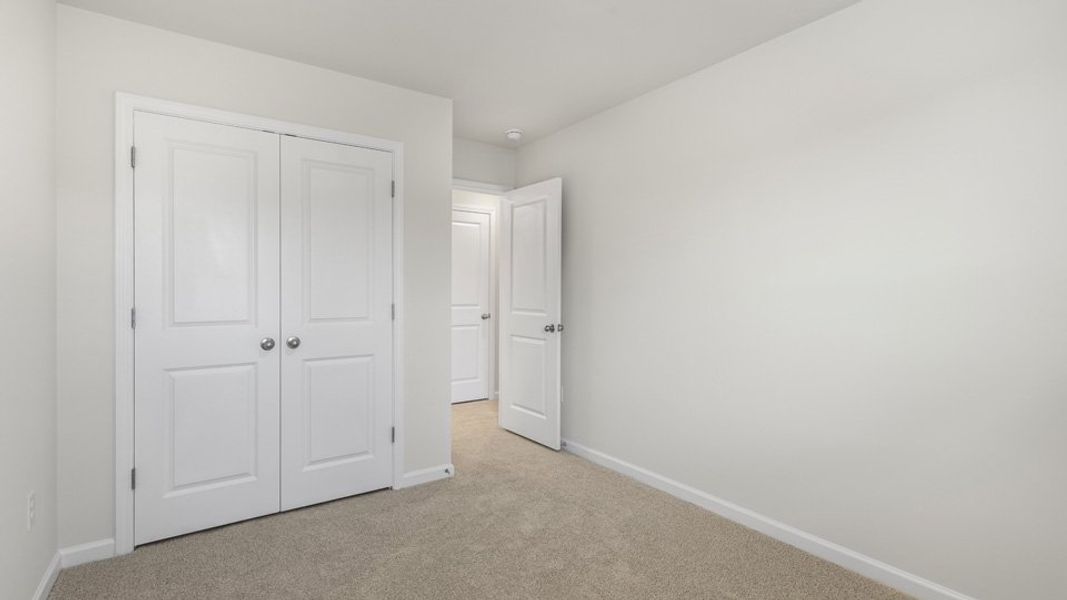 Spacious, unfurnished interior of a new home in The Townes at Galvins Ridge, Sanford (Image 19).