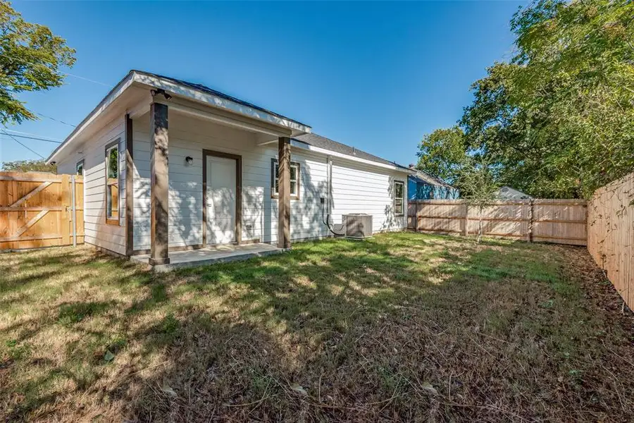 Rear view of property and yard