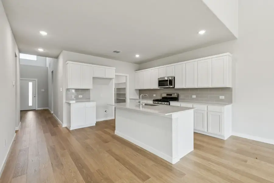 Kitchen in the Winters home plan by Trophy Signature Homes – REPRESENTATIVE PHOTO