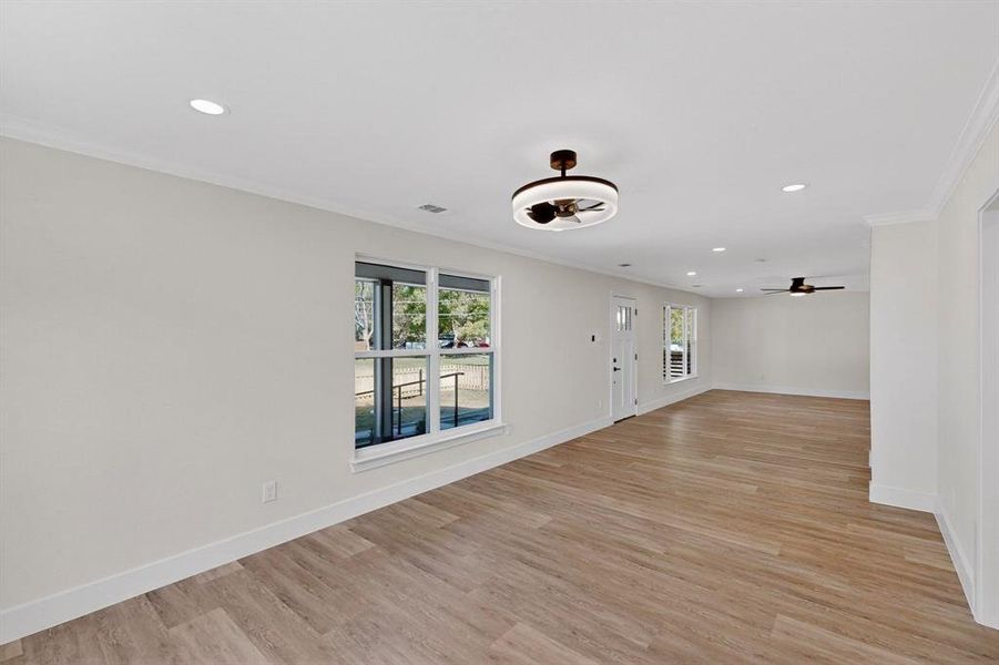 Foyer featuring recessed lighting, crown molding, light wood-style floors, and a ceiling fan