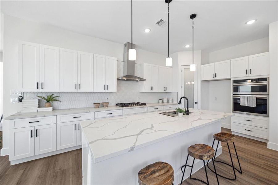 Large gourmet kitchen that will delight the senses.  Quartz countertops, soft close cabinets, stainless steel appliances, including a refrigerator (not shown).