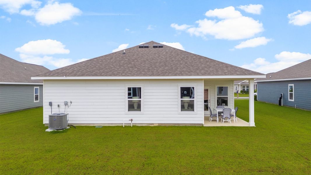 Front exterior of a new home in Liberty, Panama City, FL, highlighting curb appeal (Image 22). Front exterior of a new home in Liberty, Panama City, FL, highlighting curb appeal (Image 22).