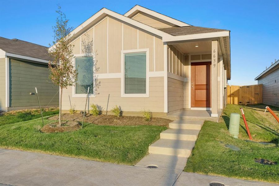 Modern home featuring a front yard