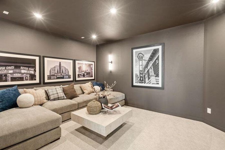 The home provides a separate media room. Representative image.