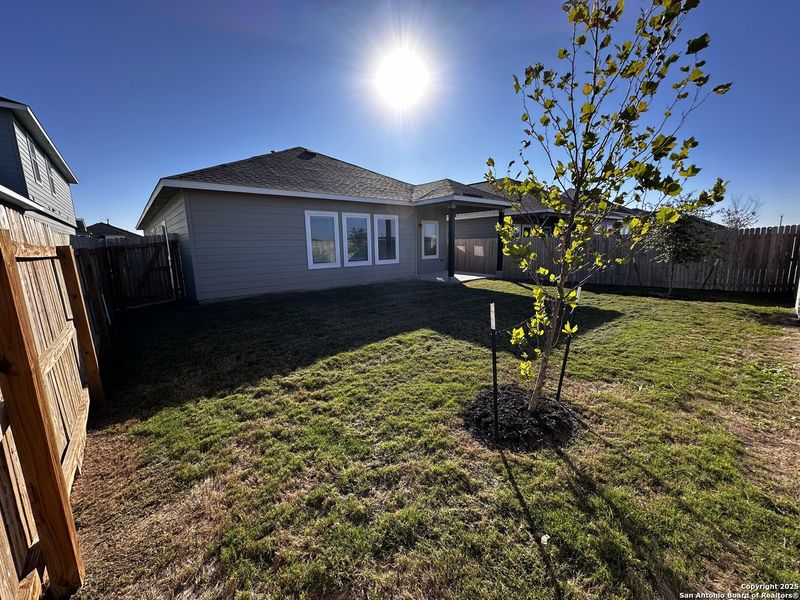 Exterior details and patio area of a home in Hennersby Hollow, San Antonio (Image 16).