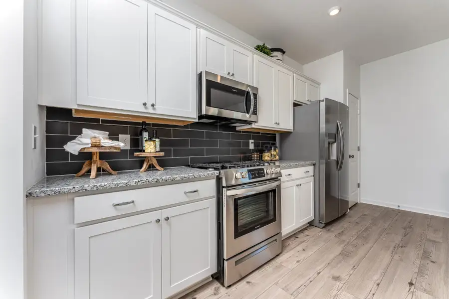 Furnished interior view inside a new home in Marlin Pointe, White House (Image 9).