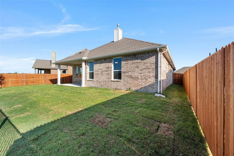 Exterior details and patio area of a home in Morningstar, Aledo (Image 19).