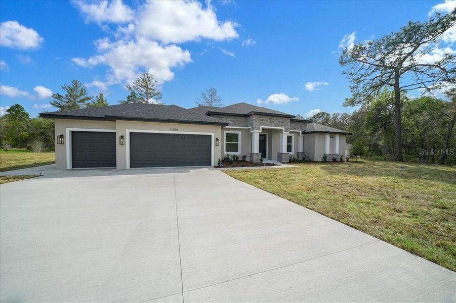 Front exterior of a new home in , Weeki Wachee, FL, highlighting curb appeal (Image 30).