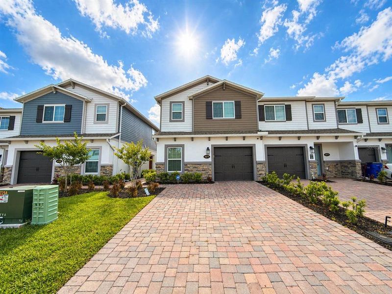 Front exterior of a new home in , St. Cloud, FL, highlighting curb appeal (Image 24).