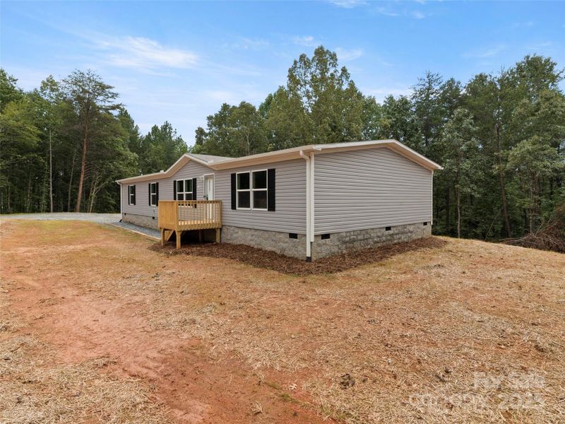 Front exterior of a new home in , Mill Spring, NC, highlighting curb appeal (Image 2). Front exterior of a new home in , Mill Spring, NC, highlighting curb appeal (Image 2).