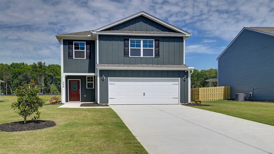 Front exterior of a new home in Sease's Pond, Gilbert, SC, highlighting curb appeal (Image 1). Front exterior of a new home in Sease's Pond, Gilbert, SC, highlighting curb appeal (Image 1).