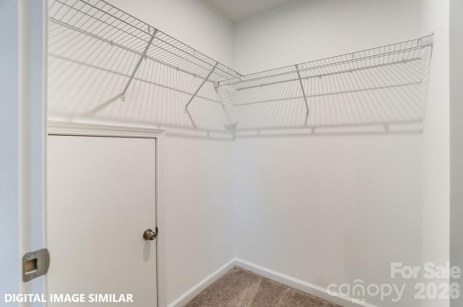 BEDROOM THREE WALK-IN CLOSET (UPPER LEVEL) - Photo is for representation purposes of floorplan only - colors, finishes, and options will vary