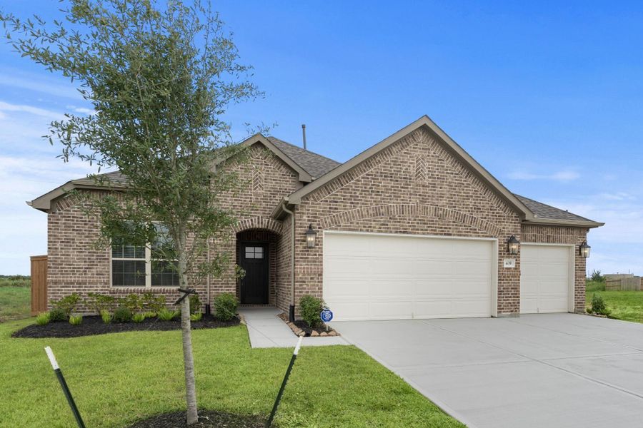 Front exterior of a new home in River Ranch, Dayton, TX, highlighting curb appeal (Image 15). Front exterior of a new home in River Ranch, Dayton, TX, highlighting curb appeal (Image 15).