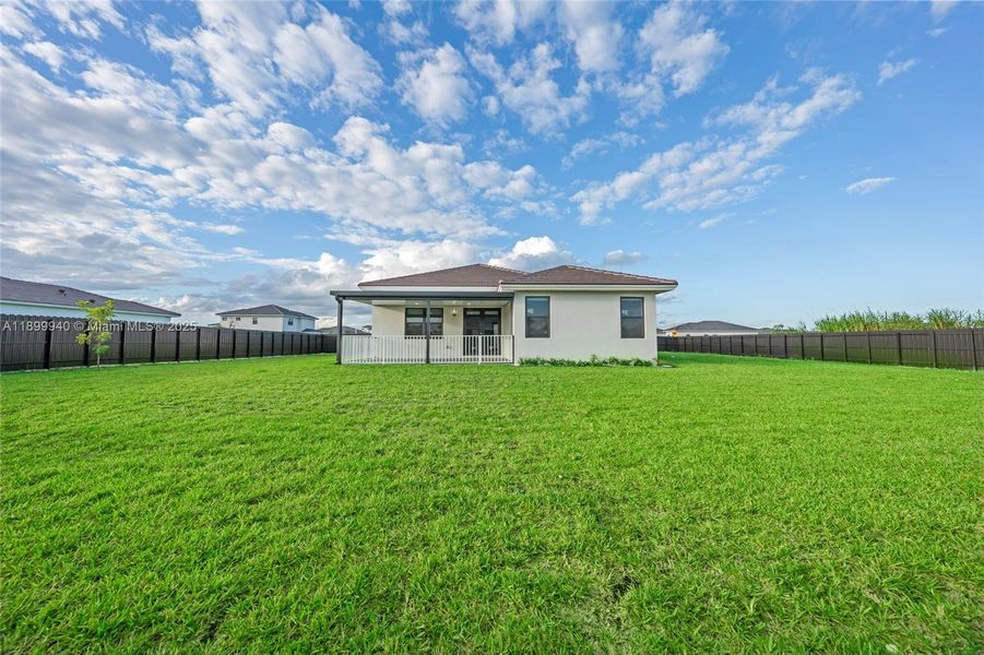 Front exterior of a new home in , Homestead, FL, highlighting curb appeal (Image 2). Front exterior of a new home in , Homestead, FL, highlighting curb appeal (Image 2).