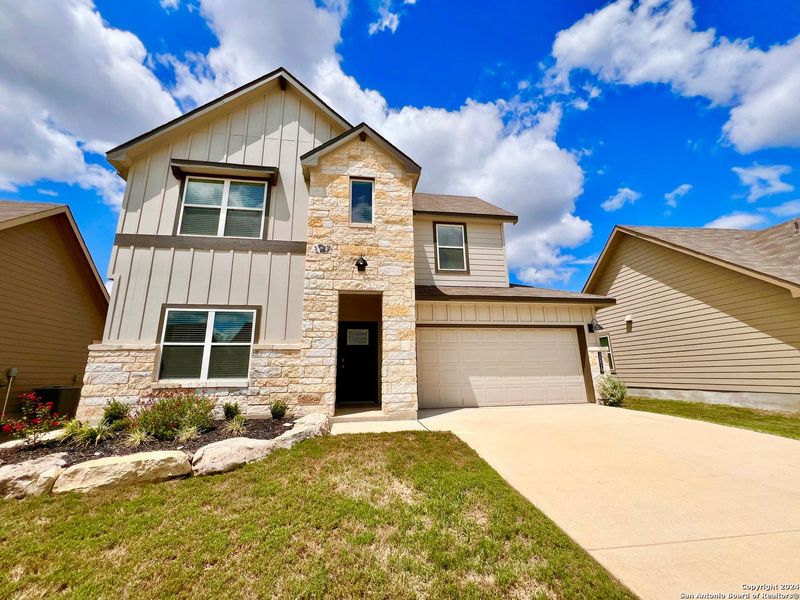 Front exterior of a new home in Brookstone Creek, San Antonio, TX, highlighting curb appeal (Image 2). Front exterior of a new home in Brookstone Creek, San Antonio, TX, highlighting curb appeal (Image 2).