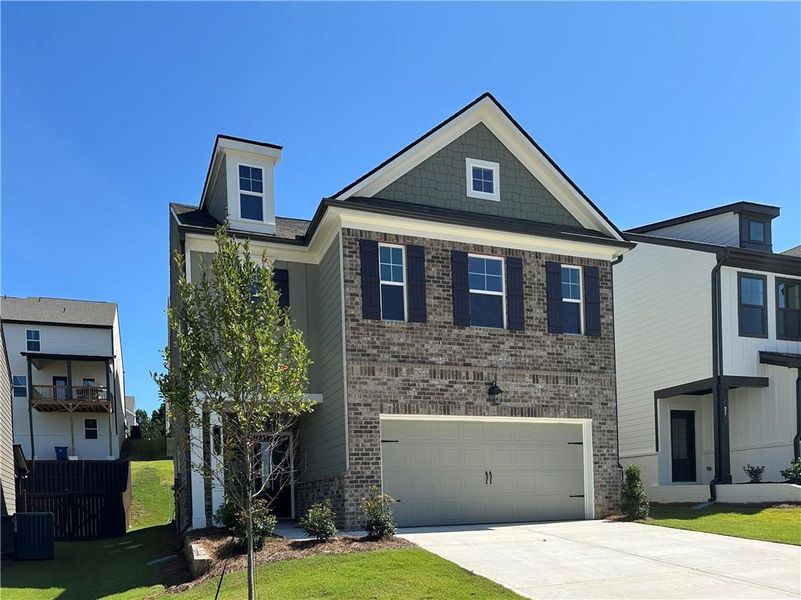 Front exterior of a new home in Kentmere, Auburn, GA, highlighting curb appeal (Image 25).