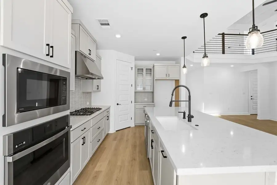 Furnished interior view inside a new home in Travisso, Leander (Image 6).
