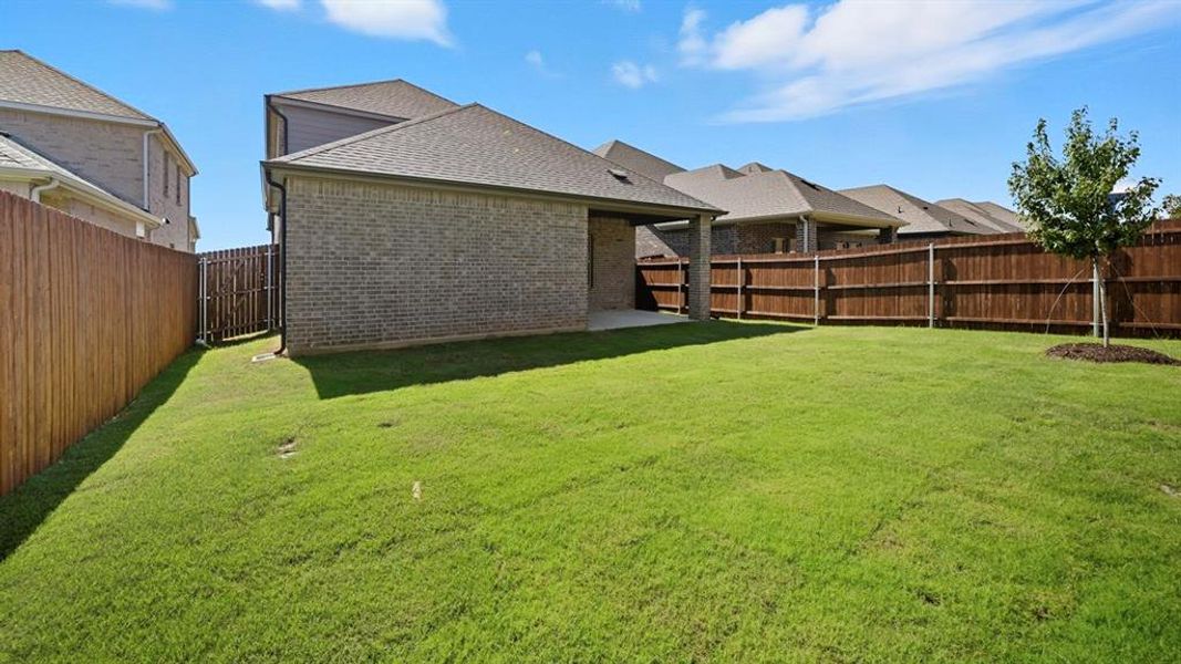 Fenced backyard featuring a patio Fenced backyard featuring a patio