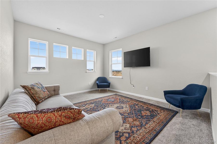 Furnished interior view inside a new home in Prelude at The Aurora Highlands, Aurora (Image 15).