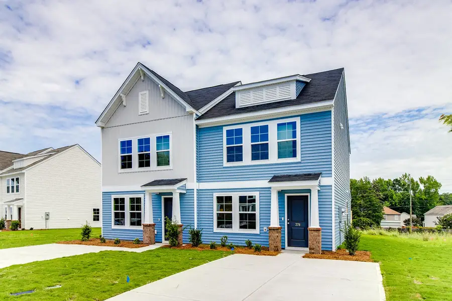 Front exterior of a new home in Padgett Commons, Hopkins, SC, highlighting curb appeal (Image 2). Front exterior of a new home in Padgett Commons, Hopkins, SC, highlighting curb appeal (Image 2).