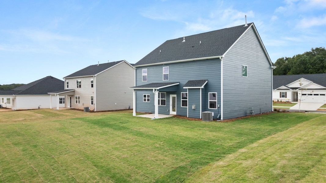 Exterior details and patio area of a home in Preserve at Dove Creek, Statham (Image 16).