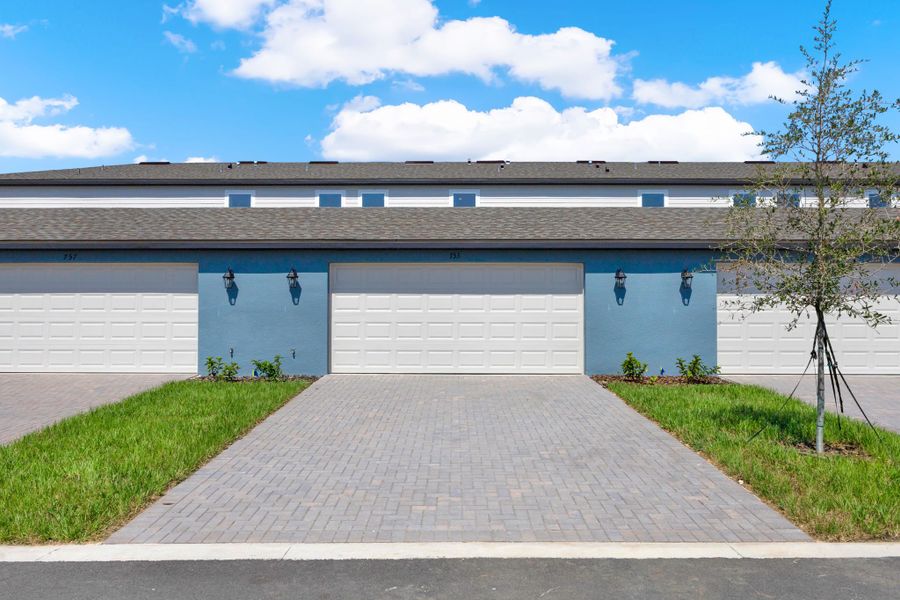 Front exterior of a new home in Eden Crest, Apopka, FL, highlighting curb appeal (Image 17).