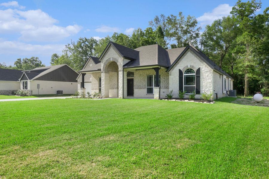 Front exterior of a new home in , Bay City, TX, highlighting curb appeal (Image 23).