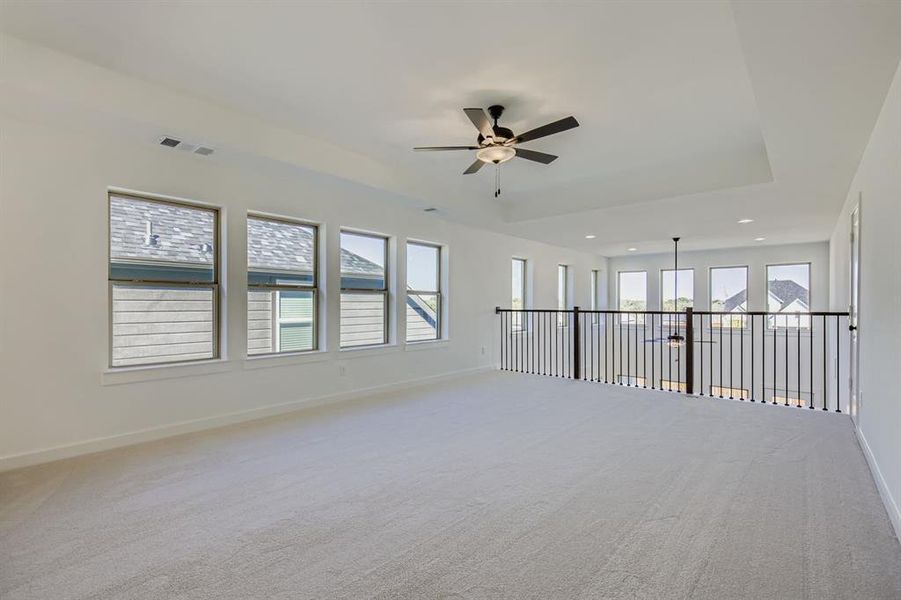 Spare room featuring light carpet, a ceiling fan, and recessed lighting Spare room featuring light carpet, a ceiling fan, and recessed lighting