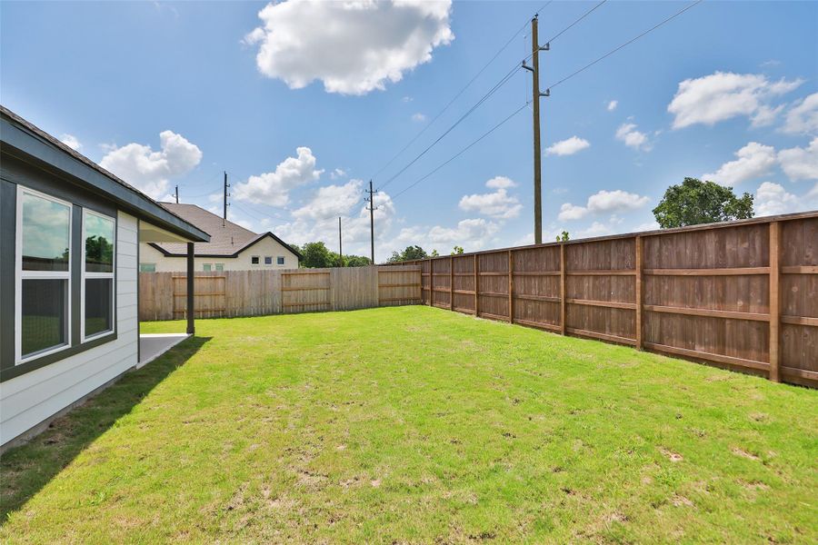 Front exterior of a new home in Oakwood Estates, Waller, TX, highlighting curb appeal (Image 2). Front exterior of a new home in Oakwood Estates, Waller, TX, highlighting curb appeal (Image 2).