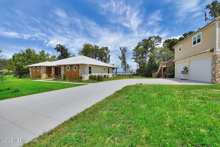 Front exterior of a new home in , East Palatka, FL, highlighting curb appeal (Image 30). Front exterior of a new home in , East Palatka, FL, highlighting curb appeal (Image 30).