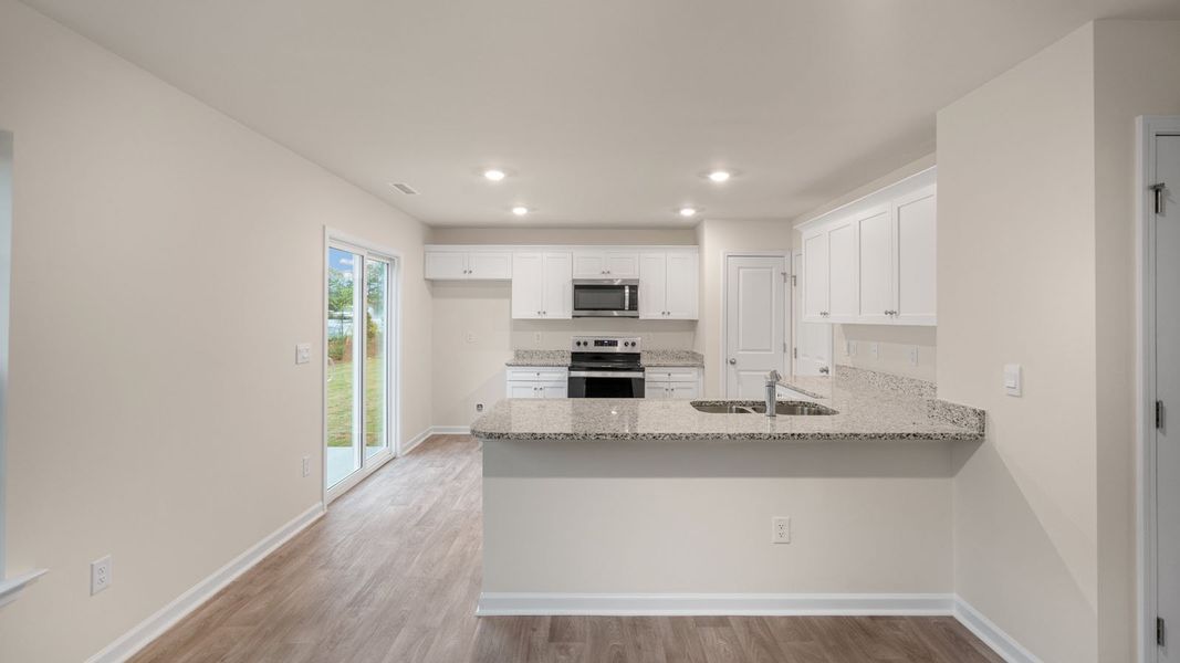 Furnished interior view inside a new home in Hobbs Farm, Ayden (Image 4).
