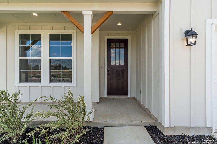 Front exterior of a new home in Weltner Farms 50’s, New Braunfels, TX, highlighting curb appeal (Image 18).