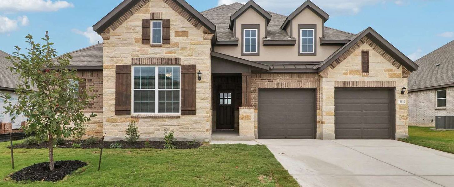 Representative exterior photo of a completed home built from the San Saba by Ashton Woods in The Heritage at Saddlebrook Ranch 70's, Schertz, TX (Image 2). Representative exterior photo of a completed home built from the San Saba by Ashton Woods in The Heritage at Saddlebrook Ranch 70's, Schertz, TX (Image 2).