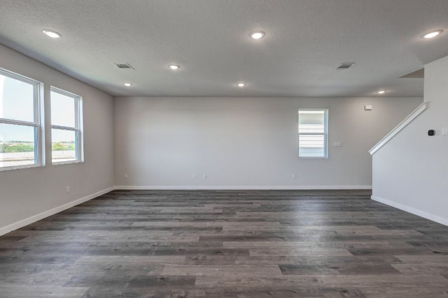 A room with windows and wood floor. A room with windows and wood floor.