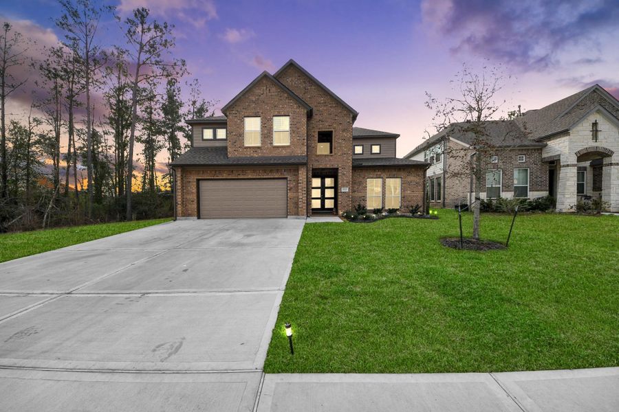 Front exterior of a new home in , Conroe, TX, highlighting curb appeal (Image 21).