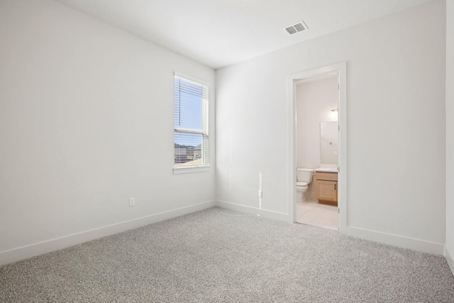 Representative unfurnished interior of a home built from the Draco by Chesmar Homes in The Grove at Blackhawk, Pflugerville (Image 14).