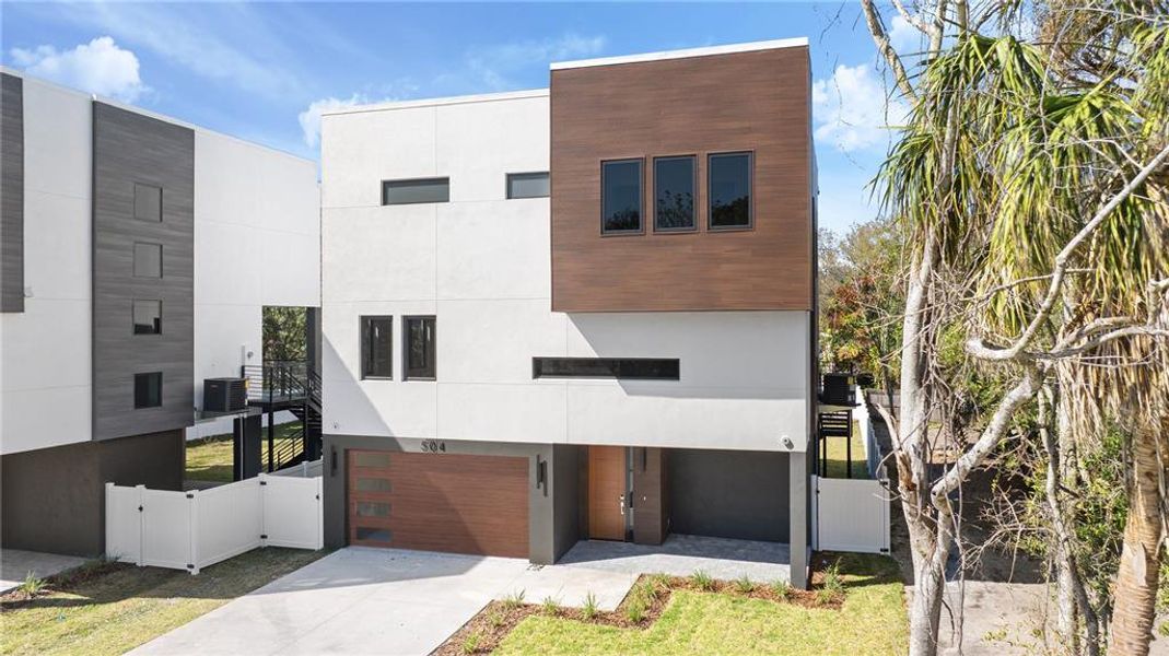 Front exterior of a new home in , Oldsmar, FL, highlighting curb appeal (Image 25).