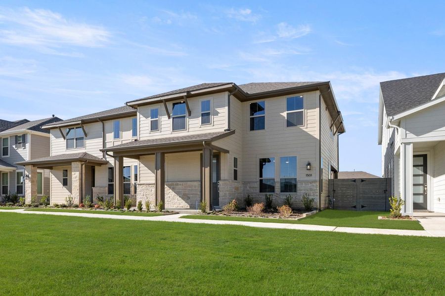 Front exterior of a new home in The Retreat at Harvest, Argyle, TX, highlighting curb appeal (Image 2). Front exterior of a new home in The Retreat at Harvest, Argyle, TX, highlighting curb appeal (Image 2).