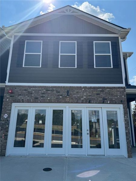 Front exterior of a new home in The Enclave Townhomes, Hampton, GA, highlighting curb appeal (Image 15).