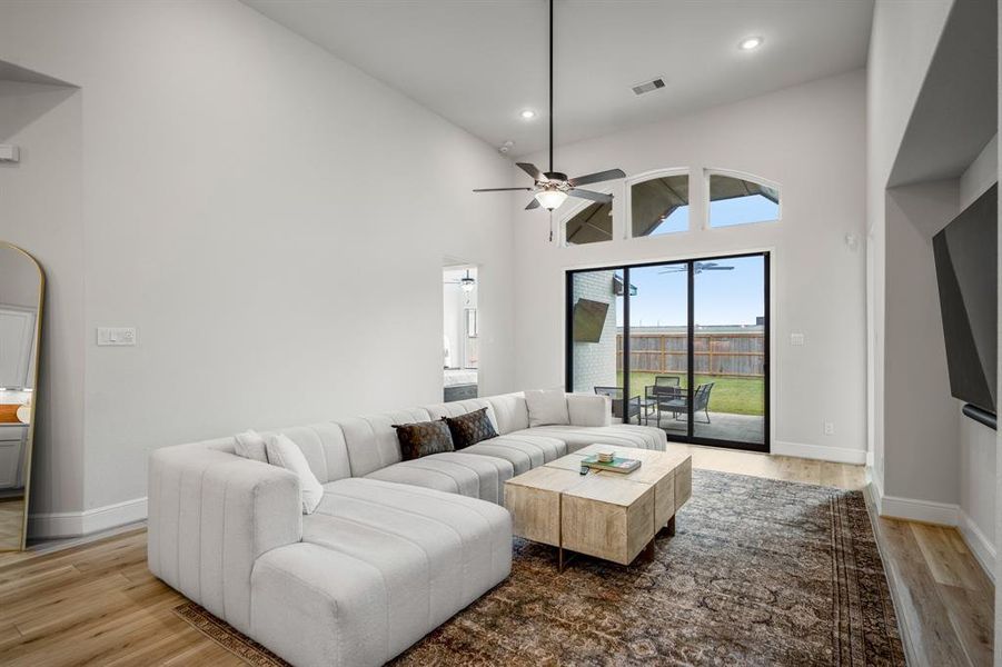 This living room goes beyond just an indoor entertaining space and can be opened up via sliding glass doors to an covered patio, outdoor kitchen, and backyard! Talk about the perfect indoor outdoor entertaining space.