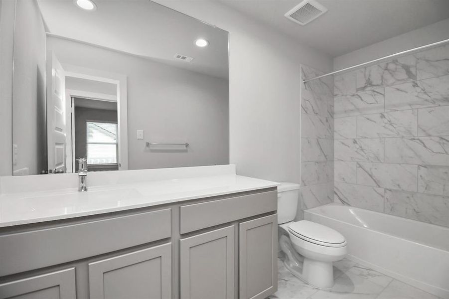 Modern secondary bath. Sample photo of completed home with similar floor plan. As-built interior colors and selections may vary.