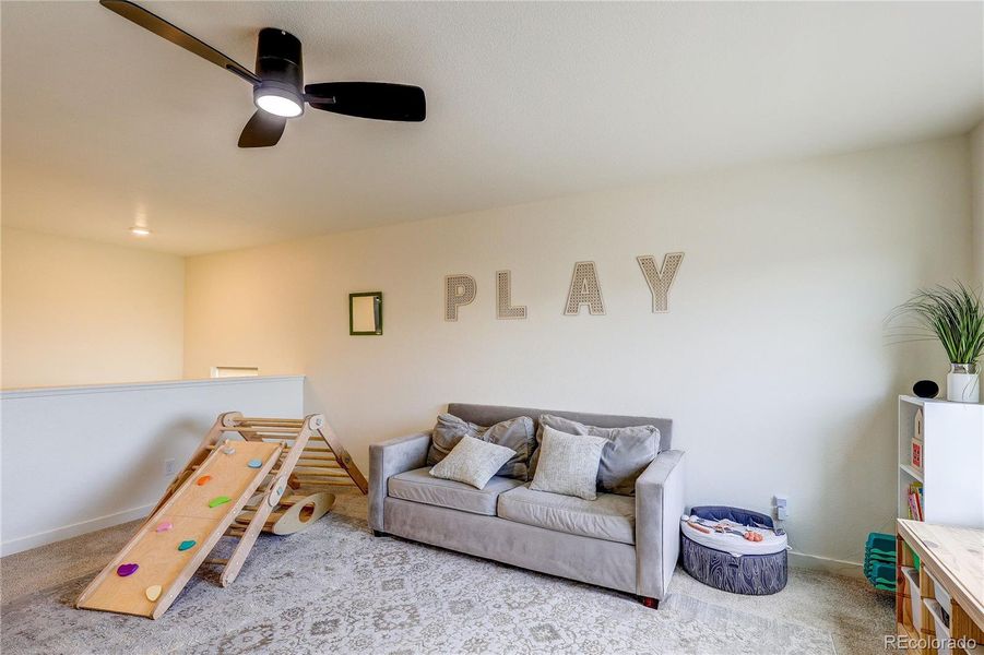 On the upper level is a spacious loft that makes a wonderful playroom or a second family room On the upper level is a spacious loft that makes a wonderful playroom or a second family room